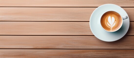 Poster - A coffee cup tablet and laptop are arranged on a table to create a visually appealing copy space image