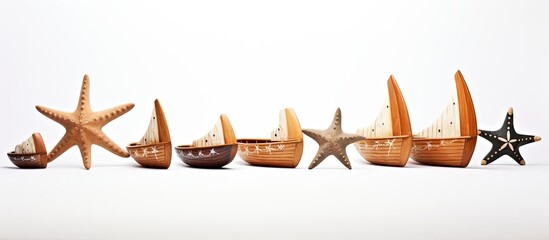 Sticker - A variety of starfish themed wooden boats displayed on a white background Copy space image