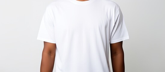 Poster - Copy space image of a blank white shirt worn by a young man isolated on a white background representing a T shirt design and clothing idea
