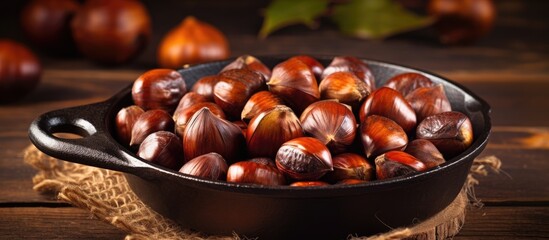 Aufkleber - Chestnuts perfectly roasted and served in a rustic chestnut pan rest on a vintage table creating a charming copy space image
