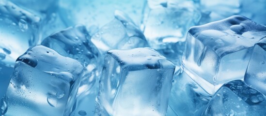 Leinwandbilder - A light blue background sets the stage for crystal clear ice cubes in this copy space image creating a color tone effect