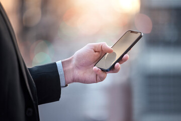 Leinwandbilder - Phone, search and businessman hands in city street for travel, chat or planning, text or b2b networking on commute. Smartphone, research and entrepreneur with app for location, map or taxi service