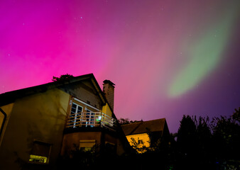 Wall Mural - aurora over the house in the night in germany