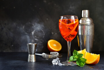 Wall Mural - Delicious italian cocktail aperol spritz with orange in a glasses .