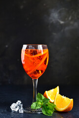 Wall Mural - Delicious italian cocktail aperol spritz with orange in a glasses .