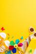 Vibrant vertical image featuring playful summer educational tools including sneakers, sunglasses, notebooks, and a decorative pinwheel placed on a bright yellow background