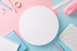 A birds-eye view of a minimalist workspace with vibrant pastel-colored stationery and a blank white circle for copy space, ideal for back to school themes
