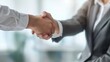 © best stock - Business handshake. Business people making a handshake, close up. Two corporate businessman shaking hands during meeting in office