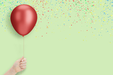 Aufkleber - Female hand holding the red balloon on mint background with confetti. Empty space for text
