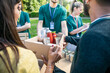 © loreanto - Food bank - Group of volunteers in uniform prepare boxes of basic necessities to donate them to people in need