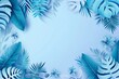 abstract background with blue color and tropical leaves, top view on light blue background