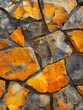 Close-up of a mosaic of fractured orange rocks.