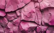 Overhead view of cracked pink stones forming a textured pattern.