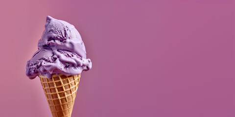 purple ice cream with waffle cone isolated on a purple background, copy space