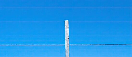 electric post on blue sky. copy space available