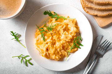 Wall Mural - Scrambled eggs on white plate