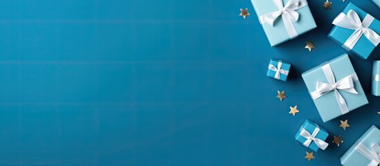 Poster - Flat lay composition with gift boxes on blue background space for text Greeting card. copy space available