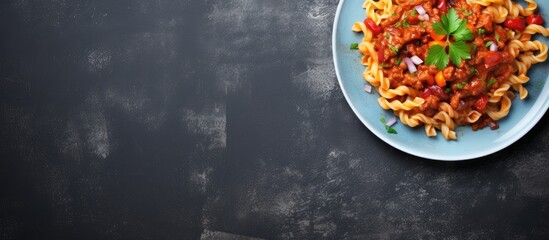Poster - Stewed pasta with minced beef and vegetables macaroni in Navy style on a plate grey concrete background Copy space