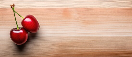 Poster - cherry on light wooden background with copy space plan view