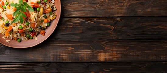 Poster - A bird s eye view of a colorful Asian stir fried rice dish with vegetables perfect for using as a copy space image