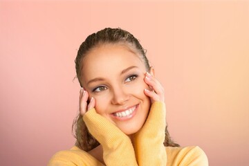 Wall Mural - Portrait happy young woman on pink background.