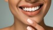 © marimalina - The image shows a close-up of the lower half of a woman's face, highlighting a bright and cheerful smile. She has healthy, white teeth, and her skin is smooth with a neutral tone.
