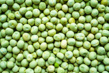 Fototapeta  - Background of a green peas grains close up. Food pattern.