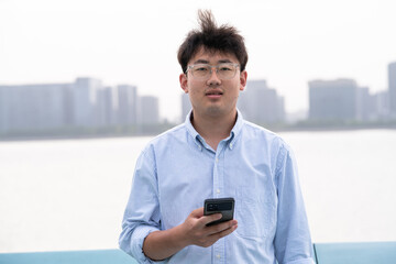 businessman using mobile phone in park