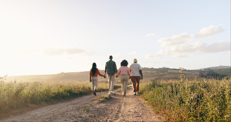 Wall Mural - Group, friends and holding hands with vacation, back and summer break with adventure, fresh air and journey. People, outdoor and holiday with road trip getaway, trust and nature with mountains