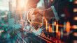 © Irina Sharnina - Business people handshake, double exposure with stock market graphic chart. Concept of investment, partnership, teamwork.