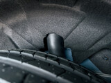 Fototapeta  - rear suspension system of a passenger car, inner fender mudguard, splasher