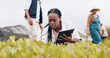 © peopleimages.com - Woman, tablet and inspection at greenhouse or teamwork for vegetable food supply chain, agriculture or quality control. Black person, technology and check land development, eco friendly or production