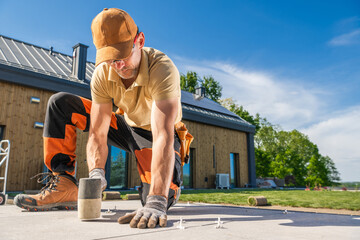 Wall Mural - Construction Worker Leveling Concrete Patio Tiles