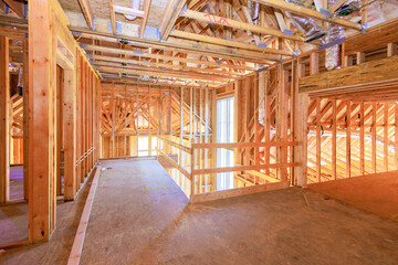 Canvas Print - New residential under construction is framing an unfinished wood frame with wooden truss, post beam framework