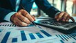 © nattapon98 - Man analyzing detailed financial reports