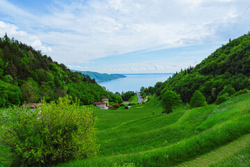 Wall Mural - Lake Garda, during spring, seen from Mount Cas, near the town of Piovere, Italy - May 4, 2024