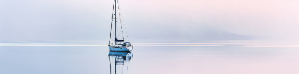 Wall Mural - Boat on the surface of a calm lake
