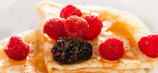 Wall Mural - Pancakes with raspberries, blackberries and honey