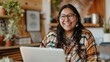 © Bijac - happy native american woman working remotely laptop video call diversity and inclusion