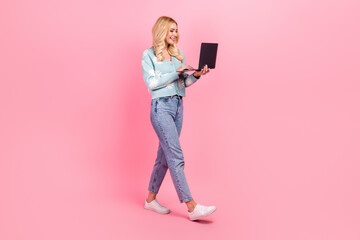 Canvas Print - Full size photo of lovely young woman hold netbook eshopping walk dressed stylish flower print garment isolated on pink color background