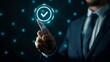 © kittikunfoto - Businessman in suit touching digital interface with glowing check mark symbol, concept of approval and completed task in technology.
