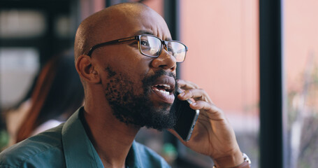 Canvas Print - Face, phone call and black man employee in office for communication, networking or negotiation. Contact, consulting or feedback with serious business person in glasses talking on mobile at workplace