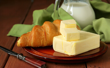 Poster - organic dairy product butter on wooden background