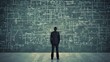© photolas - A daunting task, finding a solution a concept. A young businessman stands in front of a dark wall scribbled with complex calculations.