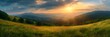 © Be Naturally - mountainous countryside scenery at sunset, dramatic sky above the distant valley, green fields and trees on the hill, beautiful nature scenery of carpathians realistic nature and landscape