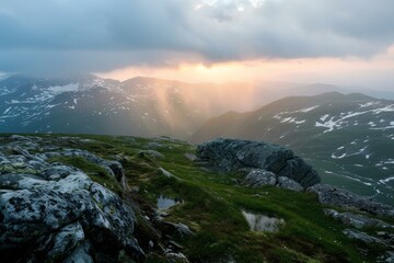 Poster - Sunlight beams through clouds above a serene mountain landscape at dusk