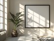 © Thares2020 - Elegant Framed Wall Decor in Sunlit Minimalist Interior with Potted Plant