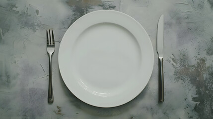 Poster - An empty white plate with a fork and a knife overhead flat lay shot on a slate background the concept of dinner : Generative AI