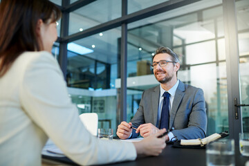 Wall Mural - Businessman, meeting and interview with client for partnership, b2b or hiring at office. Business people or intern talking to executive for recruiting, discussion or explaining contract at workplace