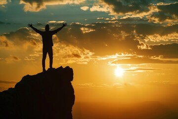 Wall Mural - Silhouette of a man standing on top of a mountain with his arms raised against a sunset sky background, a panoramic banner with space for text Generative AI